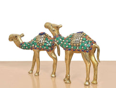Brass camel figurine pair with arched backs; green enamel banding and studded patterns