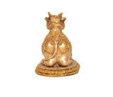 Rear view of seated Nandi bull statue with crown-like headpiece and golden decor