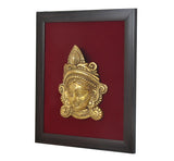 Brass Maa Durga face idol relief in dark square frame, angled view