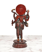 Maa Saraswati brass sculpture back view with round halo disc and four arms