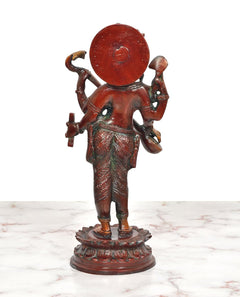 Maa Saraswati brass sculpture back view with round halo disc and four arms