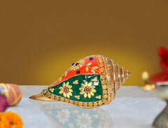 Brass shankh decor figurine with colorful floral inlay, conch-teardrop shape