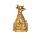 Brass Nandi bull statue, rear/side view with engraved patterns and small tail detail