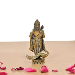 Standing brass Kartikeya murti back view, detailed robe texture on lotus base