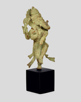 Bronze Ganesha statue dancing with trunk raised, on dark wooden cube base