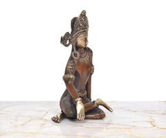 Brass Indra Devta seated statue, raised hand gesture with textured crown and earrings