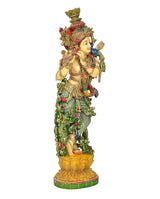 Side view of Lord Krishna resin statue playing flute, ornate green and gold clothing