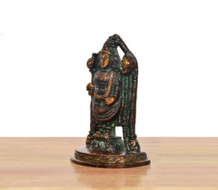 Brass Tirupati Balaji idol side view, multicolored dress folds and arched halo