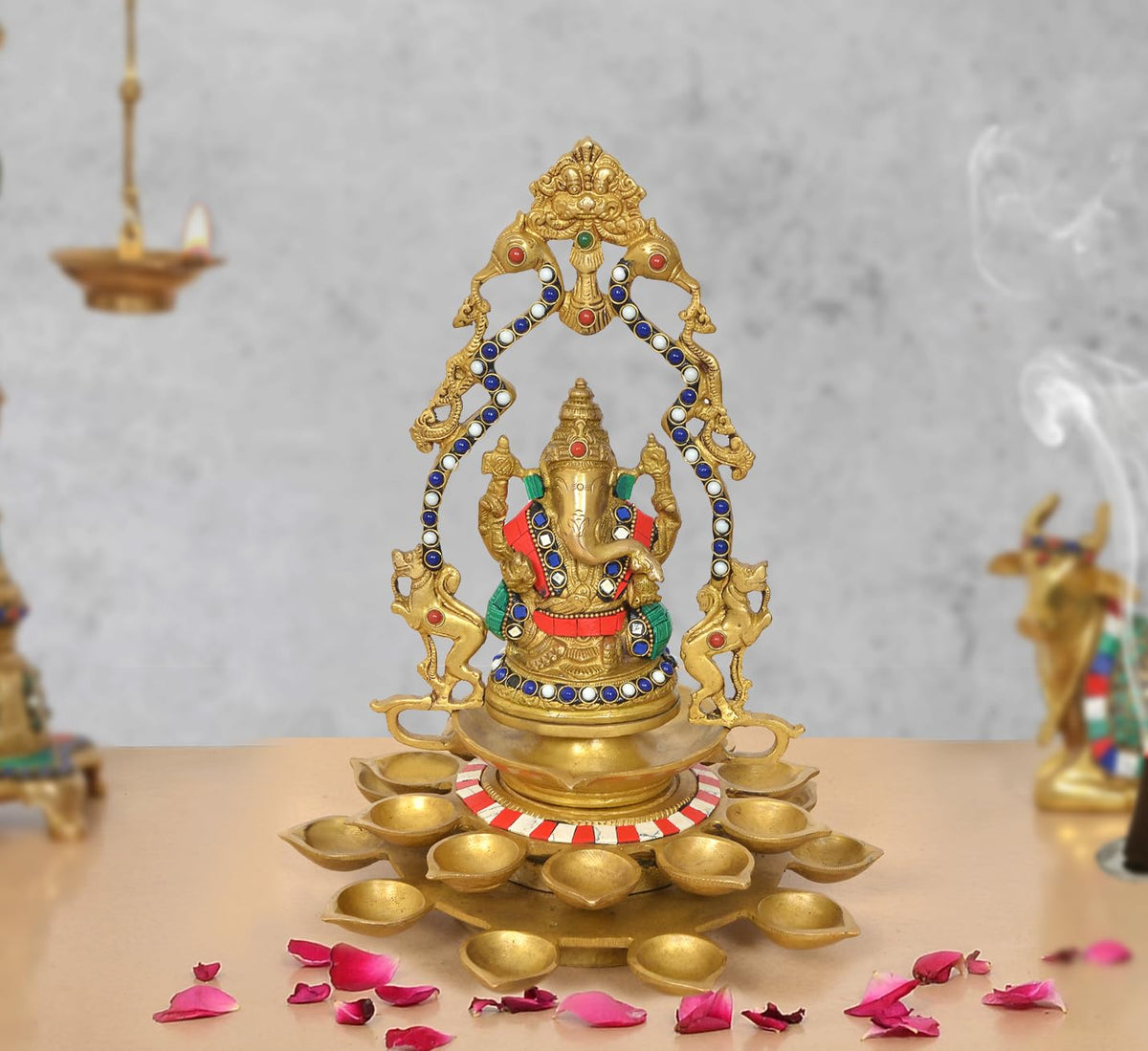 Brass Ganesh diya showpiece with 21 oil lamps, ornate arch and painted accents