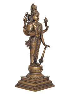 Brass Hari-Hara deity statue three-quarter view with patterned torso and leg details