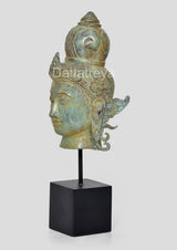 Bronze Vishnu head idol side view, decorative shoulder ornaments, on square base