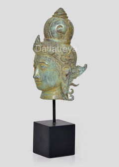 Bronze Vishnu head idol side view, decorative shoulder ornaments, on square base