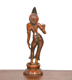 Brass goddess statue side view, standing on round base, one arm raised, beaded detailing