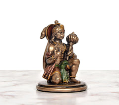 Resin Hanuman JI idol, angled view—seated blessing pose with multicolor robe and beadwork.