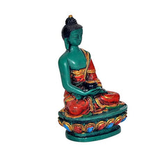 Resin Buddha idol statue side view, teal seated figure with red-gold robe and patterned base