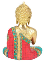 Seated brass Buddha figurine, back view with ornate torso pattern; red and teal mosaic robe