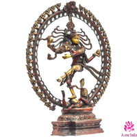Brass Nataraja metal statue in circular frame, dancing figure mid-kick