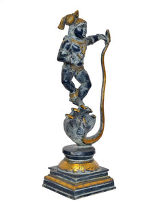 Krishna on Kaliya Naag brass statue, front view, blue-black deity with golden ornaments