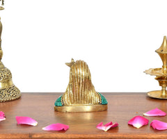Brass Adiyogi Shiva idol, back view with sculpted hair, green base