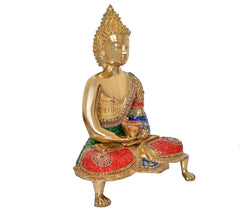 Brass Buddha idol in Dhyan mudra, seated posture, multicolor robe and gilded base.