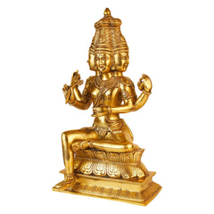 Brass seated deity figurine, detailed head crown and raised hand gestures