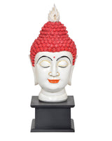 Resin Buddha head statue facing front, red headdress beads, black pedestal base