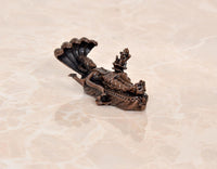 Copper Vishnu-Lakshmi idol on Sheshnag serpent, rear view with fan-like hood