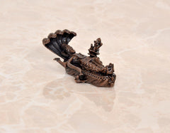 Copper Vishnu-Lakshmi idol on Sheshnag serpent, rear view with fan-like hood