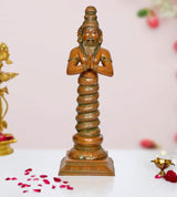 Brass Patanjali statue with hands in prayer, standing on ornate pedestal base.