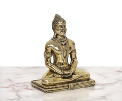 Brass Mahavir Jain idol, front-left view, detailed jewelry and seated pose, 5 inch