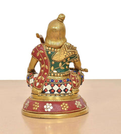 Brass Ram Lala statue from back/side, jeweled blouse and maroon patterned skirt on base