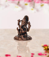 Copper Lord Ganesha murti, side angle view, seated on lotus pedestal, detailed arms