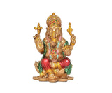 Resin Lord Ganesha sitting on lotus base, green and red attire, golden hands