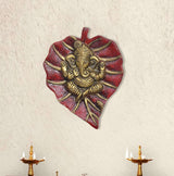Metal Ganesha wall hanging, heart-shaped red and gold relief figure