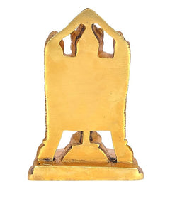 Golden brass idol base with two cutout feet and decorative underside