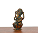 Side view of Lord Ganesha brass statue, seated posture with carved lotus pedestal