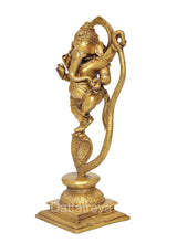 Brass Ganesha dancing idol side view, curved serpent tail and detailed pedestal