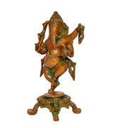Side view of brass dancing Ganesha figurine with green ornamentation and round base