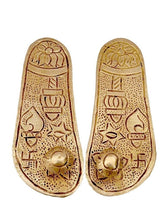 Gold brass charan paduka khadau with detailed engravings on soles, front pair