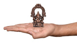 Copper Ganesha idol statue shown on palm, 4 inch height