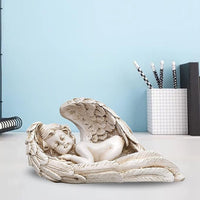 White resin angel cupid showpiece with cupid figure resting on angel wings
