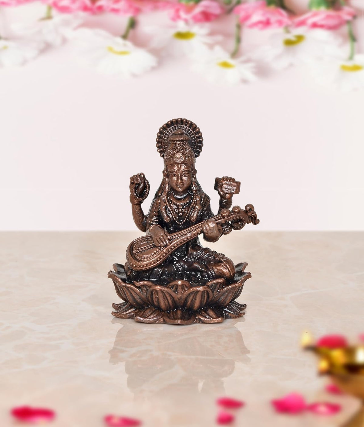 Copper Maa Saraswati idol, small seated figure holding veena on lotus base
