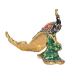 Brass peacock sculpture angled view, golden base with green and red jeweled details