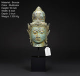 Vintage bronze Vishnu head idol with teal patina, detailed crown, mounted on pedestal