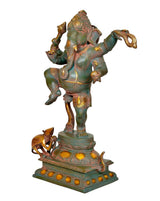 Dancing Ganesha figurine brass statue side view, mouse attendant at the base