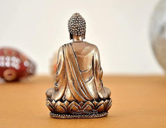 Back view: gold-tone Buddha resin statue with robe lines, seated on lotus base