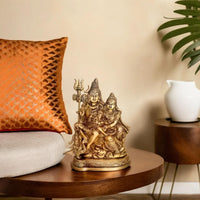 Brass Shiv Parivar Idol on pedestal; seated family figures with trident, golden finish