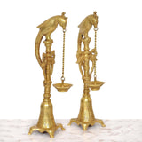 Brass parrot hanging chain diya stand, angled view, two lamp cups