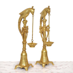 Brass parrot hanging chain diya stand, angled view, two lamp cups