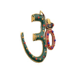 Multicolor OM wall hanging, side view with bead-studded green and red ring